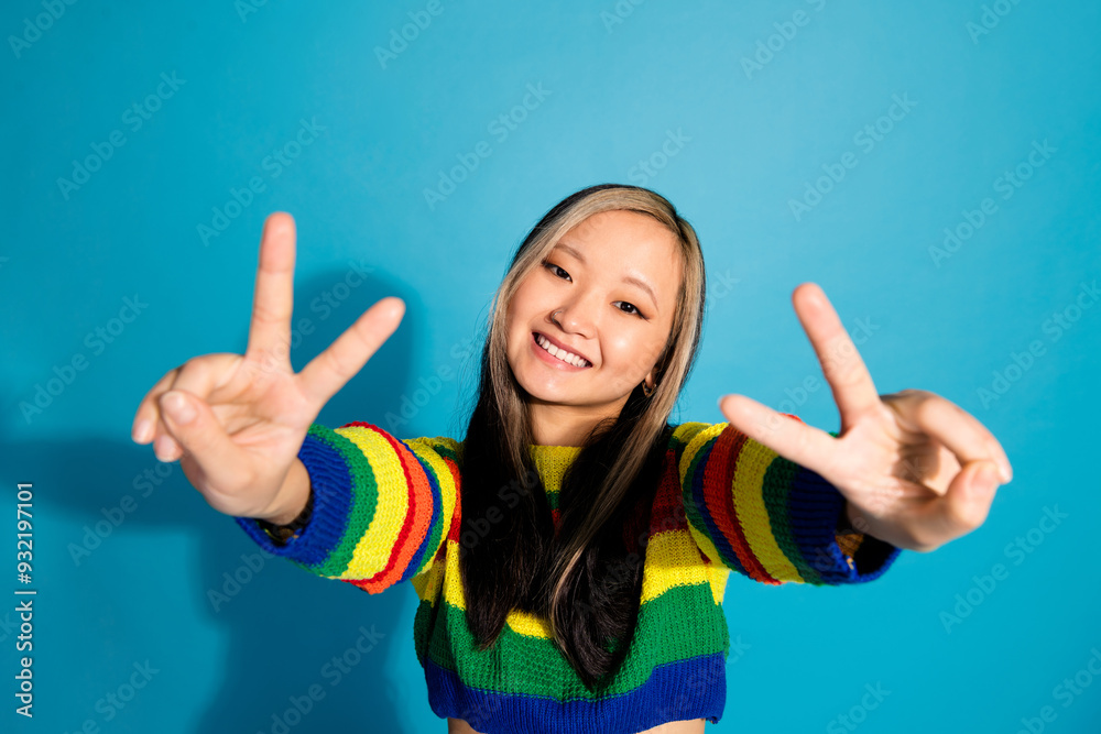 Sticker photo portrait of lovely young lady show v-sign dressed stylish striped garment isolated on blue col