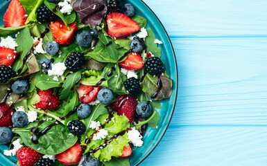 Berries salad (blueberry strawberry blackberry ) with cheese feta and balsamic sauce