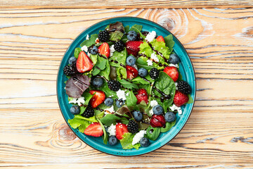 Berries salad (blueberry strawberry blackberry ) with cheese feta and balsamic sauce