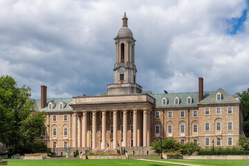 The Old Main building on the campus of Penn State University in summer sunny day, State College, Pennsylvania.