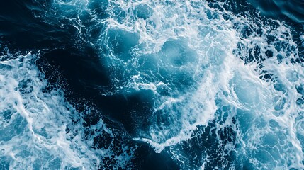 Aerial view of ocean waves creating a dynamic and vibrant sea pattern.