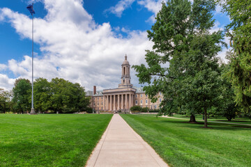 The Old Main building on the campus of Penn State University in summer sunny day, State College,...