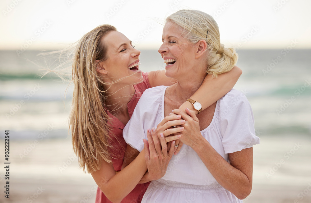 Wall mural Smile, beach and senior mom with daughter for bonding holiday, love and embrace on weekend travel. Nature, mother and woman laughing on ocean adventure together with hug, fun and island vacation.