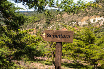 Granite rock cut anthropomorphic grave in Vale Fuzeiros at Vilarinha, Algarve, Portugal.