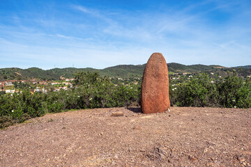 Sandstone Menir dating from 6000-4500 BC in the dry hills near Vale Fuzeiros, Algarve, Portugal.