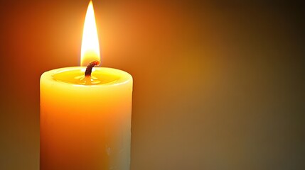   Close-up of a candle bathed in bright light from above and below