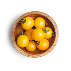 Small yellow cherry tomatoes in bowl isolated on white background.