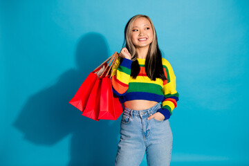 Photo portrait of lovely young lady shopping bags look empty space dressed stylish striped garment...