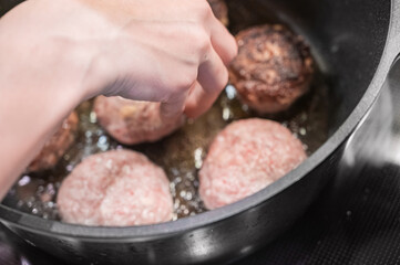 Cooking cutlets. Homemade cutlets are fried in a cauldron.