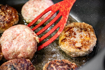 Homemade cutlets are fried in a cauldron