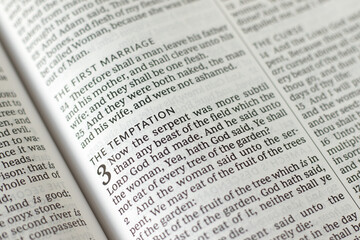 The temptation, biblical verses in holy bible book of Genesis. Close-up. Christian biblical concept.