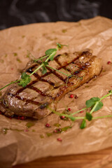 Indulge in a Delicious Grilled Steak Artfully Presented on a Wooden Serving Board