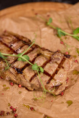 Indulge in a Delicious Grilled Steak Artfully Presented on a Wooden Serving Board
