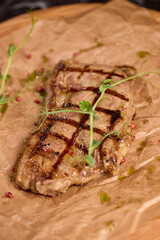 Indulge in a Delicious Grilled Steak Artfully Presented on a Wooden Serving Board