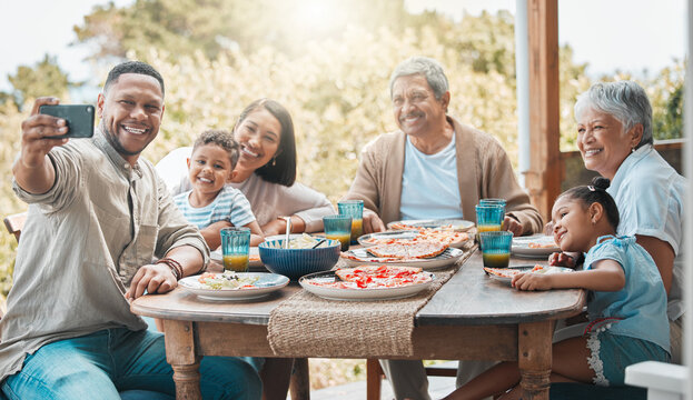 Selfie, smartphone and family outside for pizza lunch with happiness or bonding on visit, guest and excited. Mature parents, home and table with food or meal, smile and fun on holiday with memories