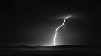 A brilliant lightning strike fractures the night sky, creating a captivating contrast against the dark backdrop with a grainy texture from the film used