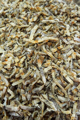 A large assortment of dried fish is on display in the Asian store.