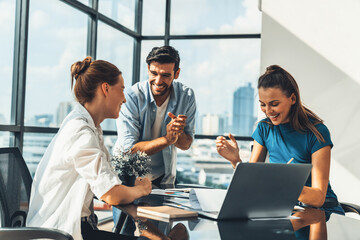 Group of happy businesspeople celebrate their successful project. Professional business team win and proud of their project at modern office. Successful teamwork, happy colleague, workplace. Tracery.