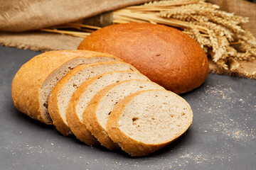 Sliced round loaf of freshly baked bread, perfect for breakfast or sandwich making