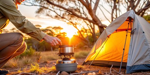 Camping Adventure - Cooking by the Fire. A man cooks a meal on a portable stove by a campfire in a serene forest setting at sunset.