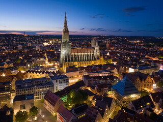 Ulm City in the evening Twilights Aerial Drone Shot. Baden-Wurttemberg, Germany. Illuminated Beautiful City at Night