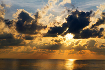 Sunrise on water in morning  at beach