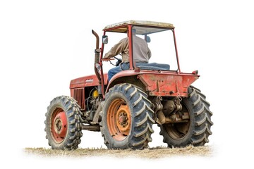 Obraz premium A person operating a vintage-style red tractor on a green field, ideal for agricultural or country-themed projects