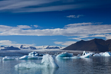 Majestic snow mountains at the South Pole, showcasing the stark beauty of the icy terrain found at the North Pole.