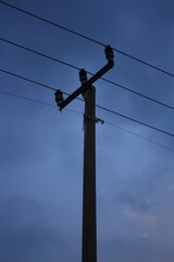 Silhouette of a power pole