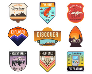 Collection of vintage camping badges featuring various wilderness-themed designs including mountains, forests, and outdoor activities. Stock travel labels isolated on white background