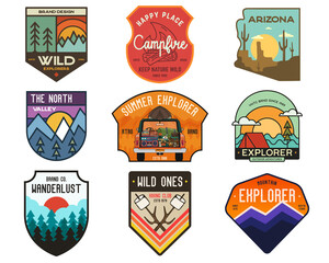 Set of vintage camping badges featuring various wilderness-themed designs including hiking, mountains, forests, and outdoor activities. Stock travel labels