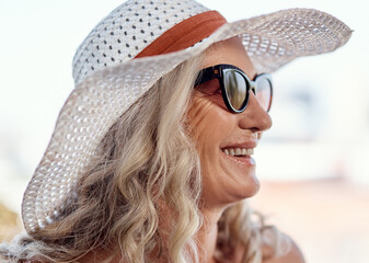 Senior woman, sunglasses and outdoor on holiday, relax and hat for vacation in nature. Female...