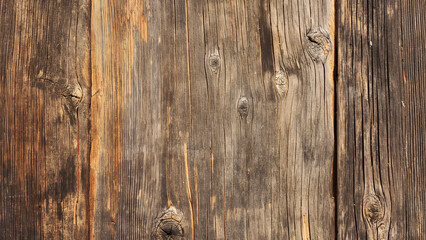 Close-up of weathered wood planks with a natural, rustic texture, ideal for backgrounds or design concepts.