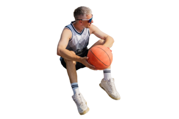 A man in sportswear sits on the ground holding a basketball, taking a break while wearing reflective sunglasses.

