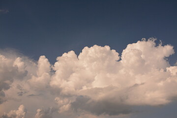 Beautiful white thick clouds on the blue sky