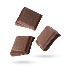 Pieces of sweet chocolate falling on white background