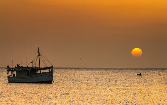 Fishing boat in Juan Griego Bay at sunset. Margarita Island, Nueva Esparta State. Venezuela.