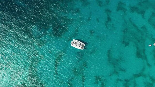 Ascending high over catamaran at Dead Man's Beach of Peter Island, BVI