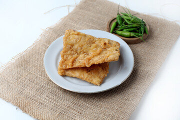 Tempe Goreng or Tempe Mendoan is Indonesian traditional food made from tempeh covered in flour batter, top view