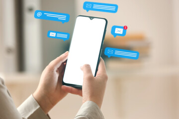 Woman using modern mobile phone in office, closeup