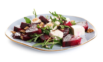 Plate of fresh salad with beet and walnut on white background