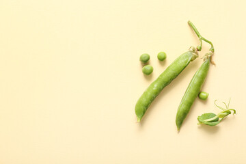 Green peas on beige background