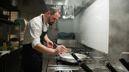 Chef Preparing The Frying Pan For The Meal