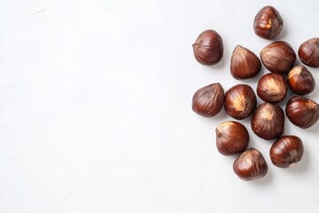 Obraz premium Shelled chestnuts on white background with space for text