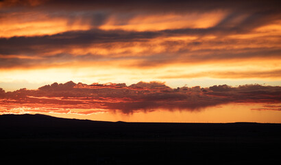 A sunset which reflects on clouds as in a lake of fire