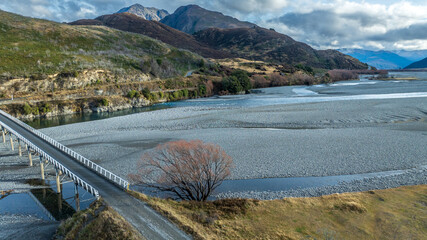 The braided Waimakariri river flowing through the rural Hawdon valley  near Arthurs Pass