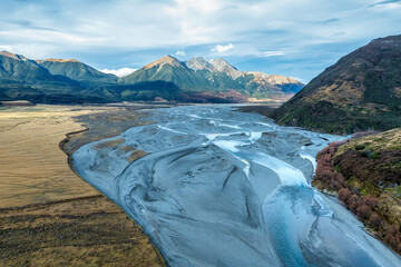 The braided Waimakariri river flowing through the rural Hawdon valley  near Arthurs Pass