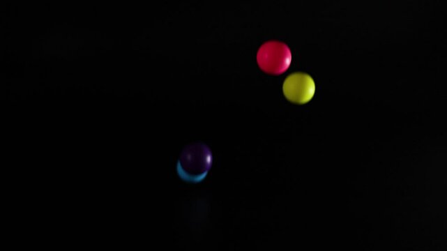 Colorful Balls Bouncing in Darkness