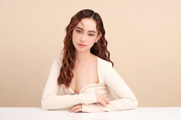 Naklejka premium Beautiful young asian woman with clean fresh skin on beige background, Face care, Facial treatment, Cosmetology, beauty and spa, Asian women portrait.
