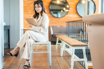 The female executive’s laptop was crucial in her office for tracking business performance metrics...